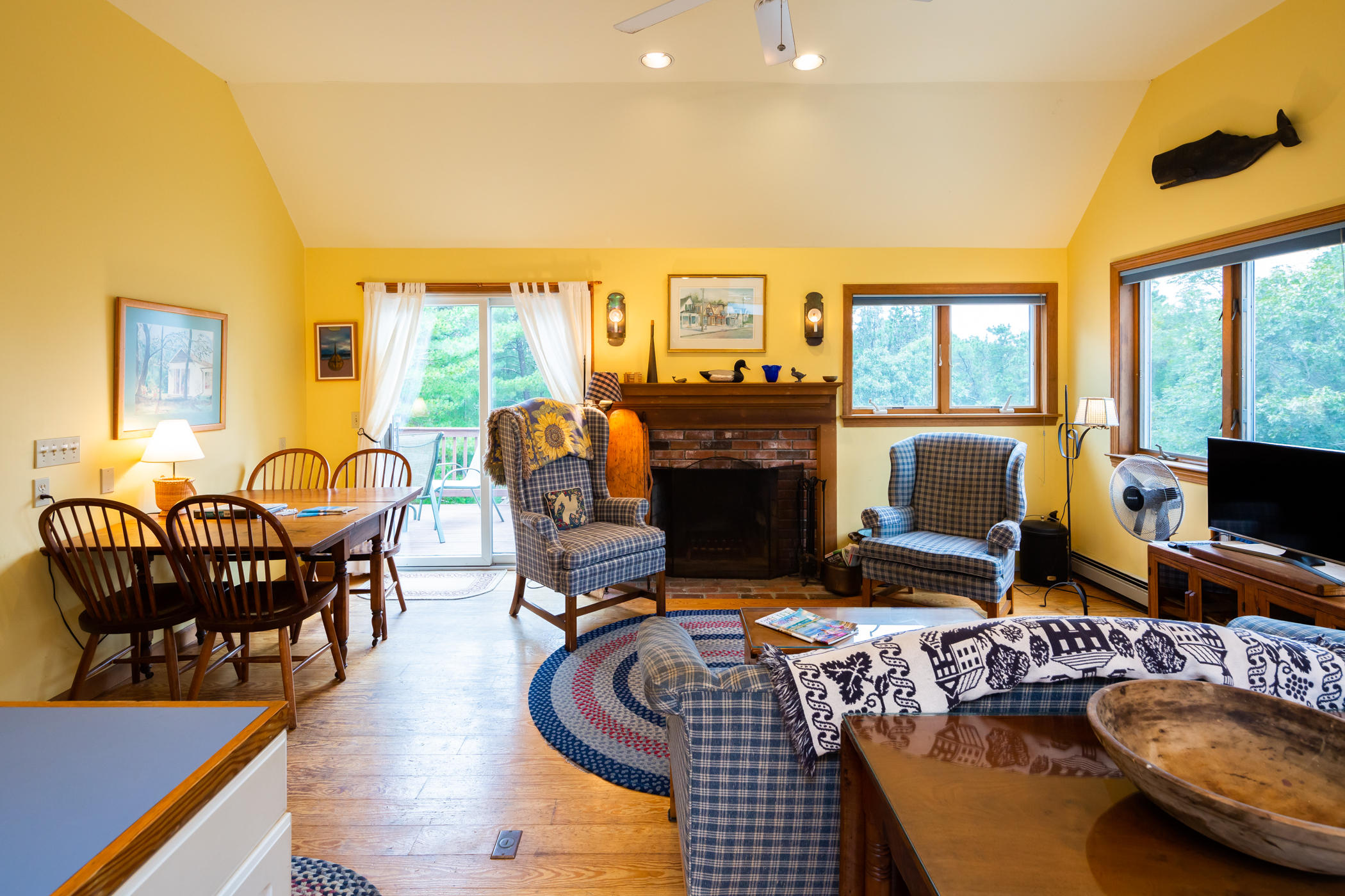 45 Marven Way Wellfleet, MA 02667 - Photo 30 of 37 a living room with furniture a fireplace and a flat screen tv