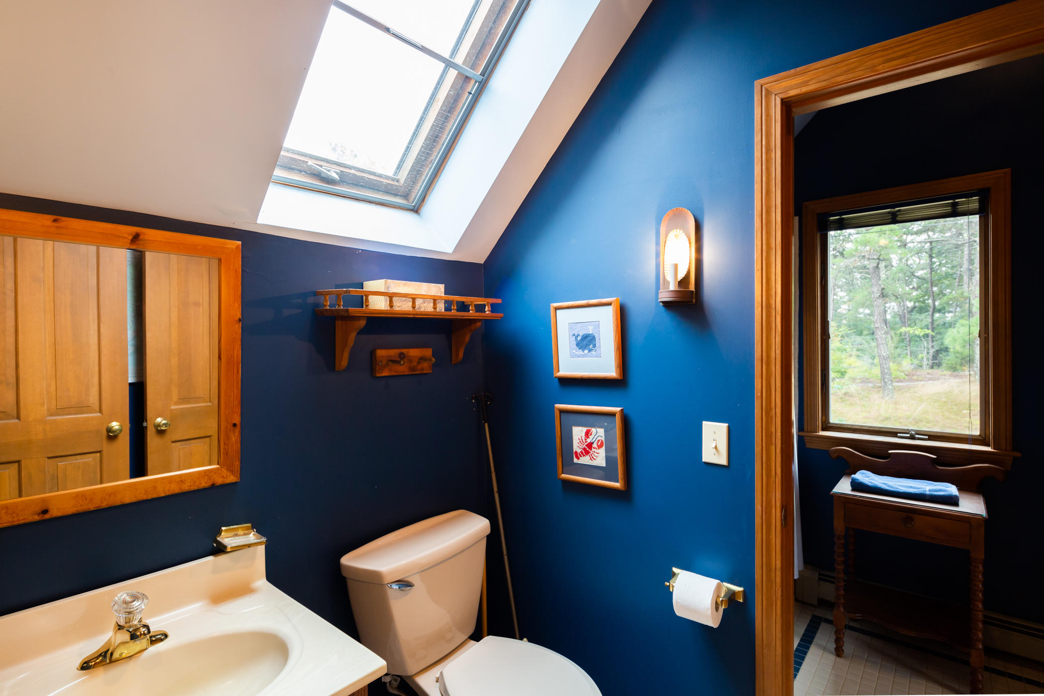 45 Marven Way Wellfleet, MA 02667 - Photo 37 of 37 a bathroom with a toilet a sink and a mirror