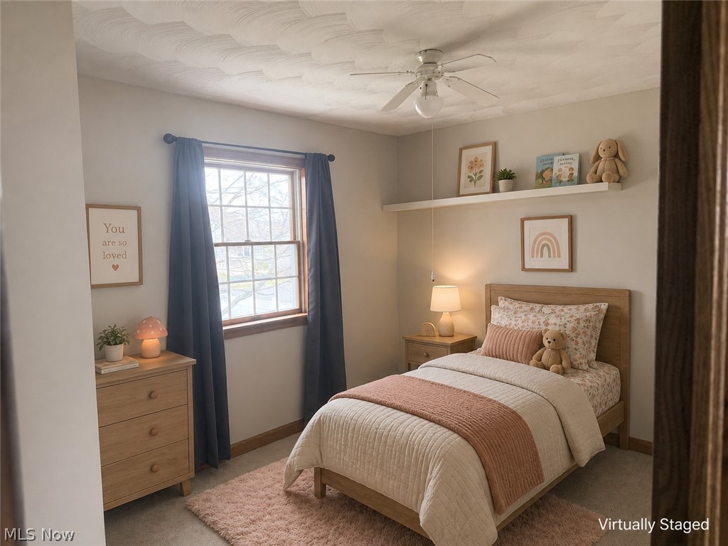 6416 Ridgeview Avenue Youngstown, OH 44515 - Photo 6 of 15 Room featuring a ceiling fan, a window with wood trim, a built-in wall shelf, a light wood bed frame, and carpet flooring