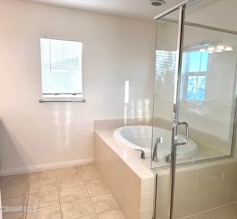 a bath tub sitting next to a window