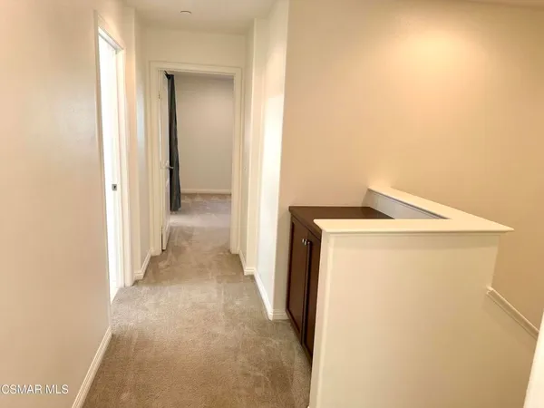 a view of a storage & utility room with a washer dryer