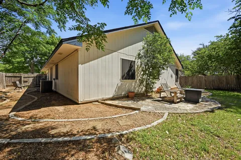 a view of a backyard of the house