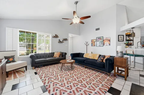 a living room with furniture and a window