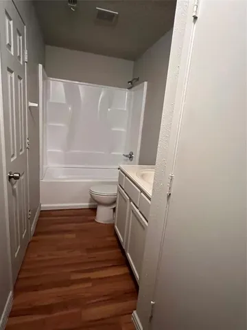 a bathroom with sink toilet and shower