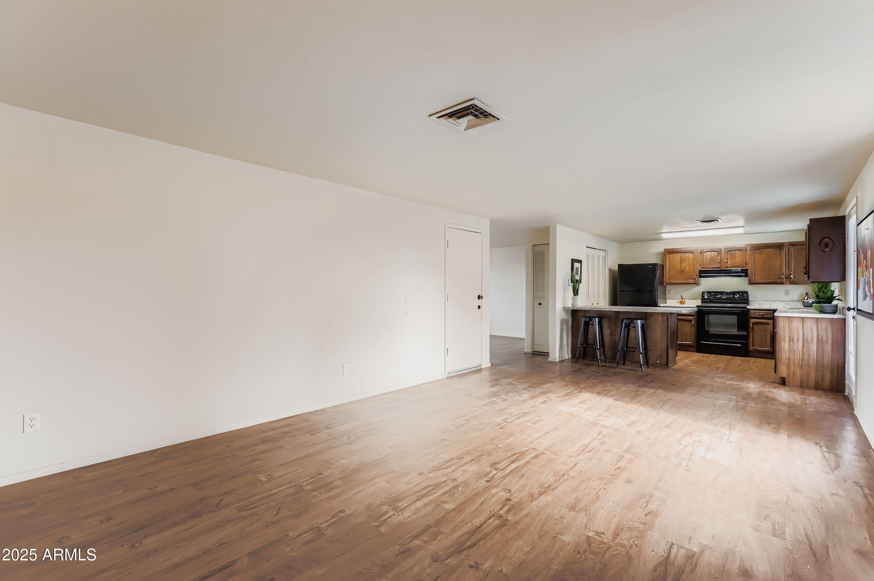 1619 West El Alba Way Chandler, AZ 85224 - Photo 13 of 26 a view of a kitchen with wooden floor