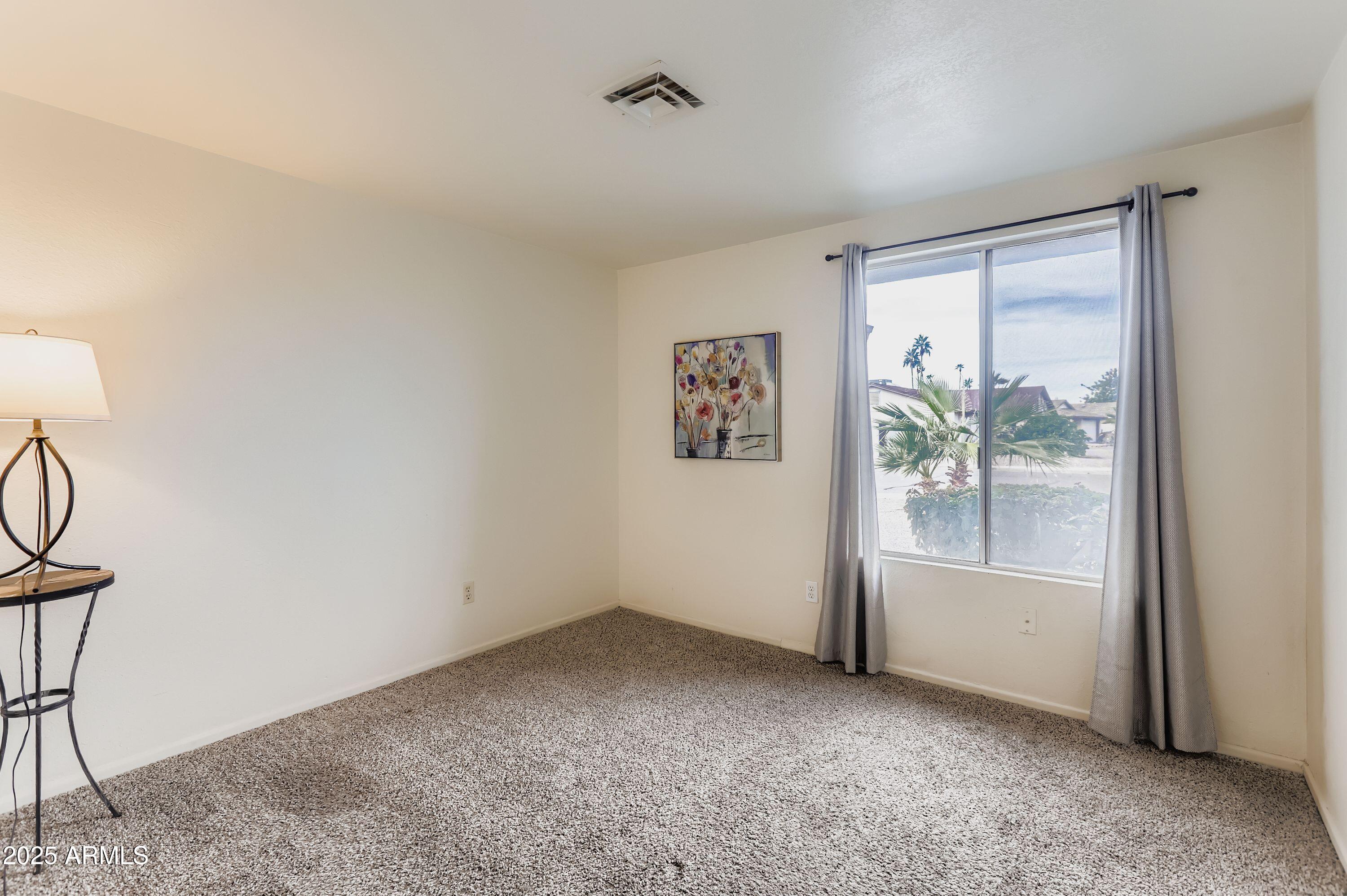 1619 West El Alba Way Chandler, AZ 85224 - Photo 17 of 26 an empty room with windows and closet