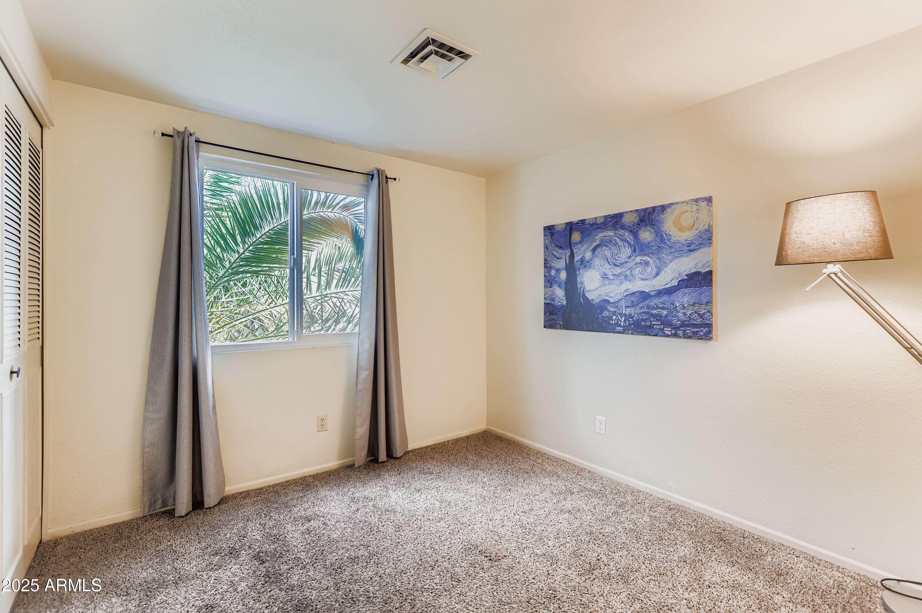 1619 West El Alba Way Chandler, AZ 85224 - Photo 19 of 26 an empty room with windows and cabinet