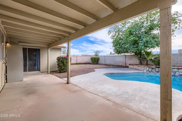 a view of backyard with green space