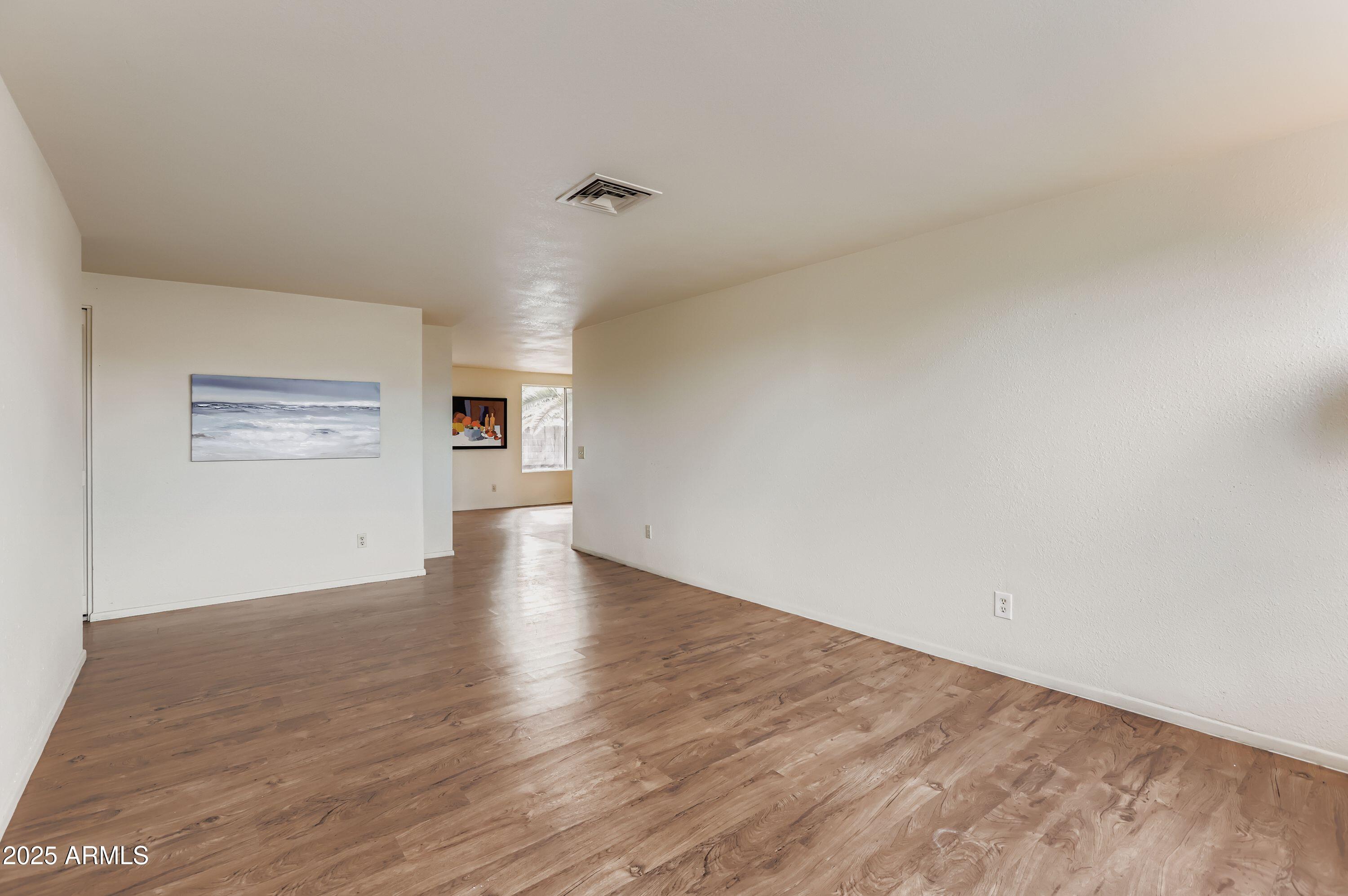1619 West El Alba Way Chandler, AZ 85224 - Photo 5 of 26 a view of a kitchen with wooden floor and a kitchen