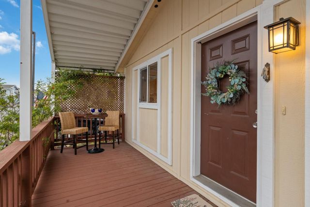 a view of a patio with table and chairs and potted plants