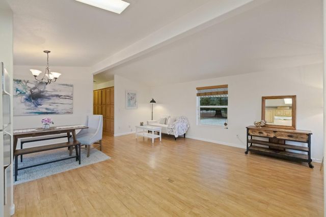 a bedroom with a bed and hallway