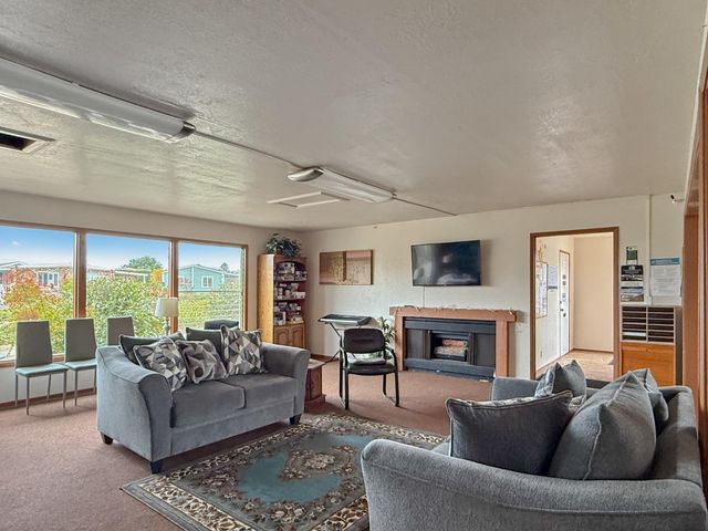 a view of house with backyard and porch