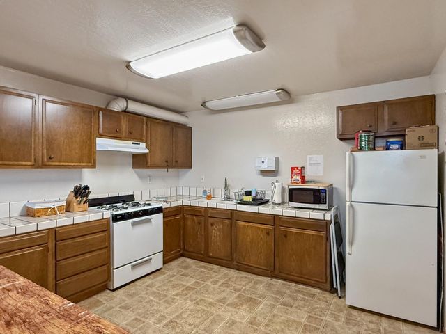 a view of a swimming pool with a yard