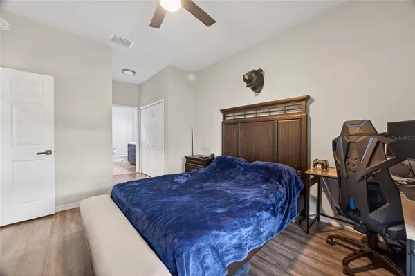 a bed sitting in a room next to a window