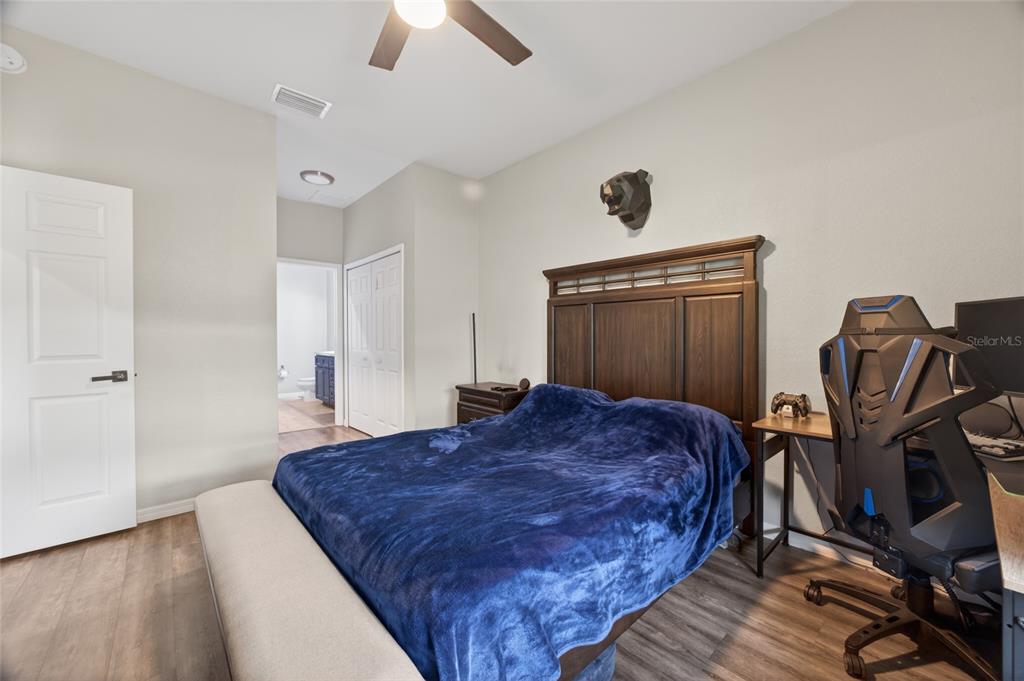 3415 West Anthony Road, Unit 303 Ocala, FL 34475 - Photo 17 of 29 a bed sitting in a room next to a window