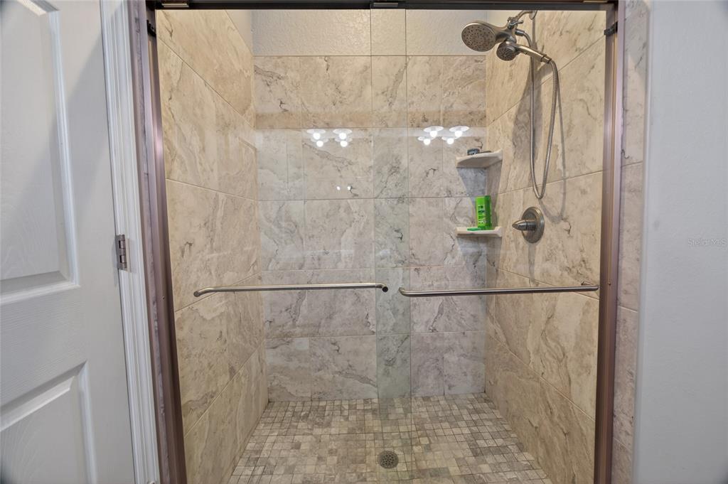 3415 West Anthony Road, Unit 303 Ocala, FL 34475 - Photo 21 of 29 a bathroom with a shower
