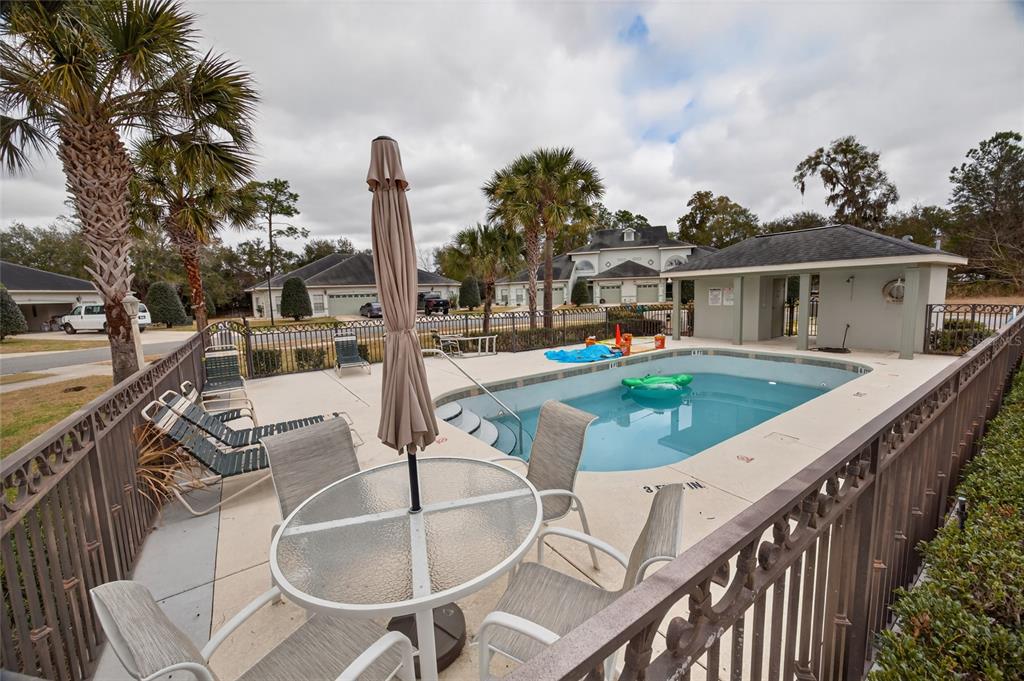 3415 West Anthony Road, Unit 303 Ocala, FL 34475 - Photo 27 of 29 swimming pool view with a seating space