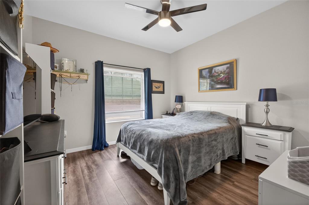 3415 West Anthony Road, Unit 303 Ocala, FL 34475 - Photo 9 of 29 a bedroom with a bed dresser and a window