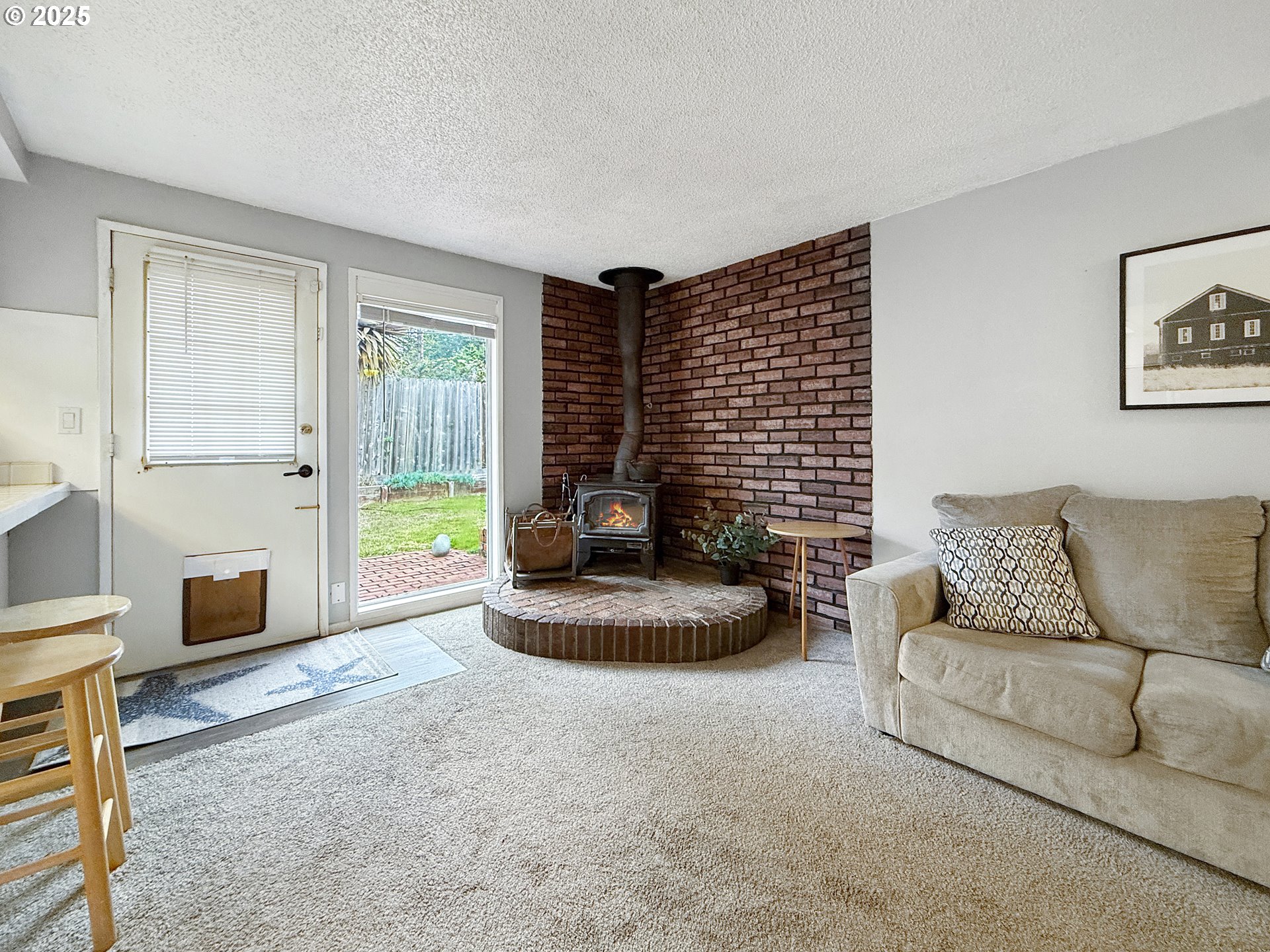 1330 Crissey Circle Brookings, OR 97415 - Photo 14 of 42 a living room with furniture and a gate