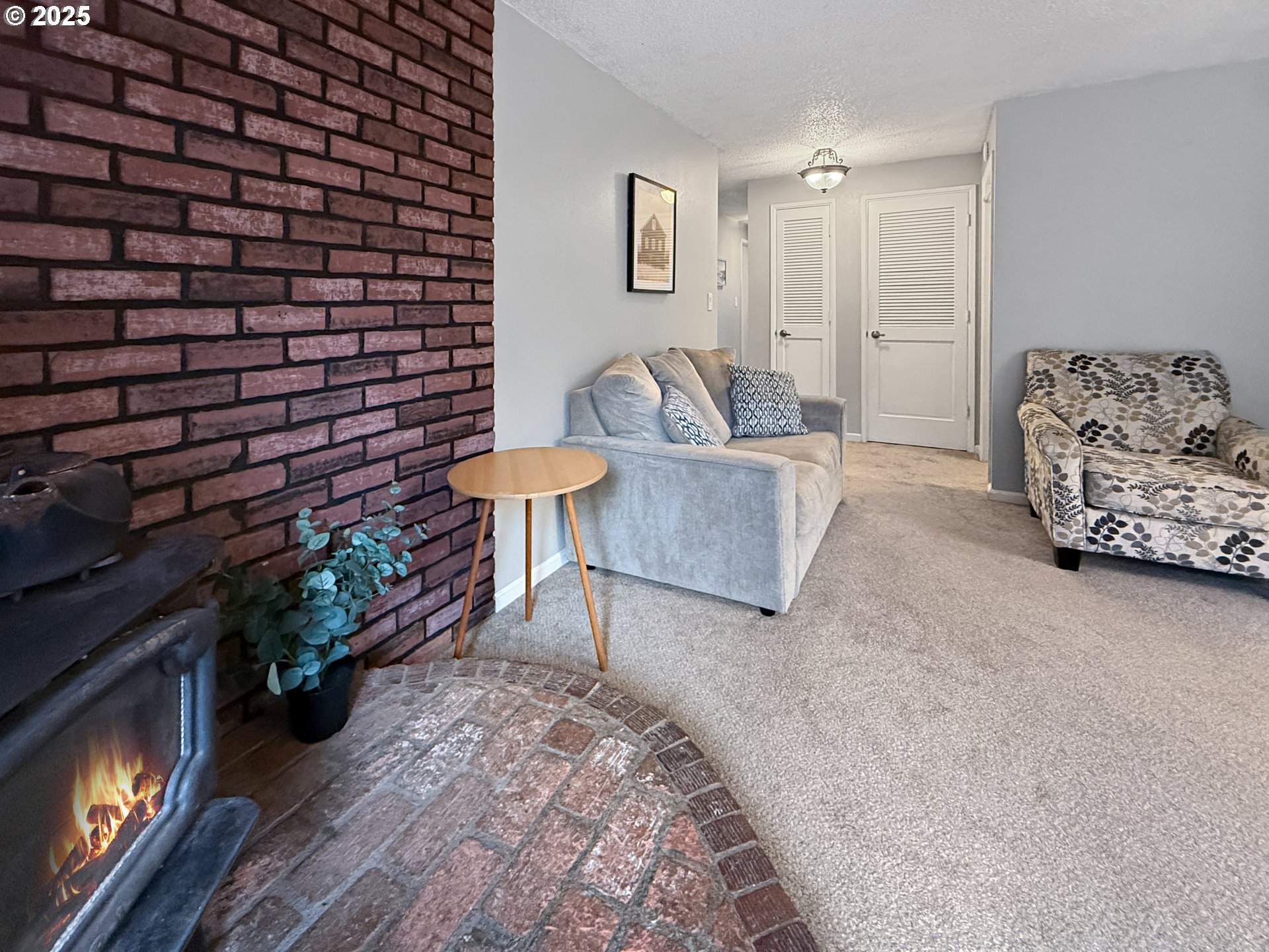 1330 Crissey Circle Brookings, OR 97415 - Photo 16 of 42 a living room with furniture and a fireplace