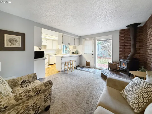 a living room with furniture window and wooden floor