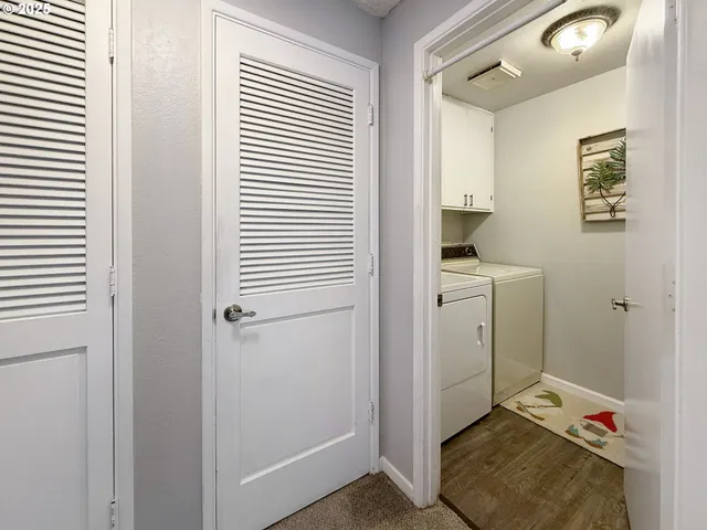 a view of room with window and hardwood floor