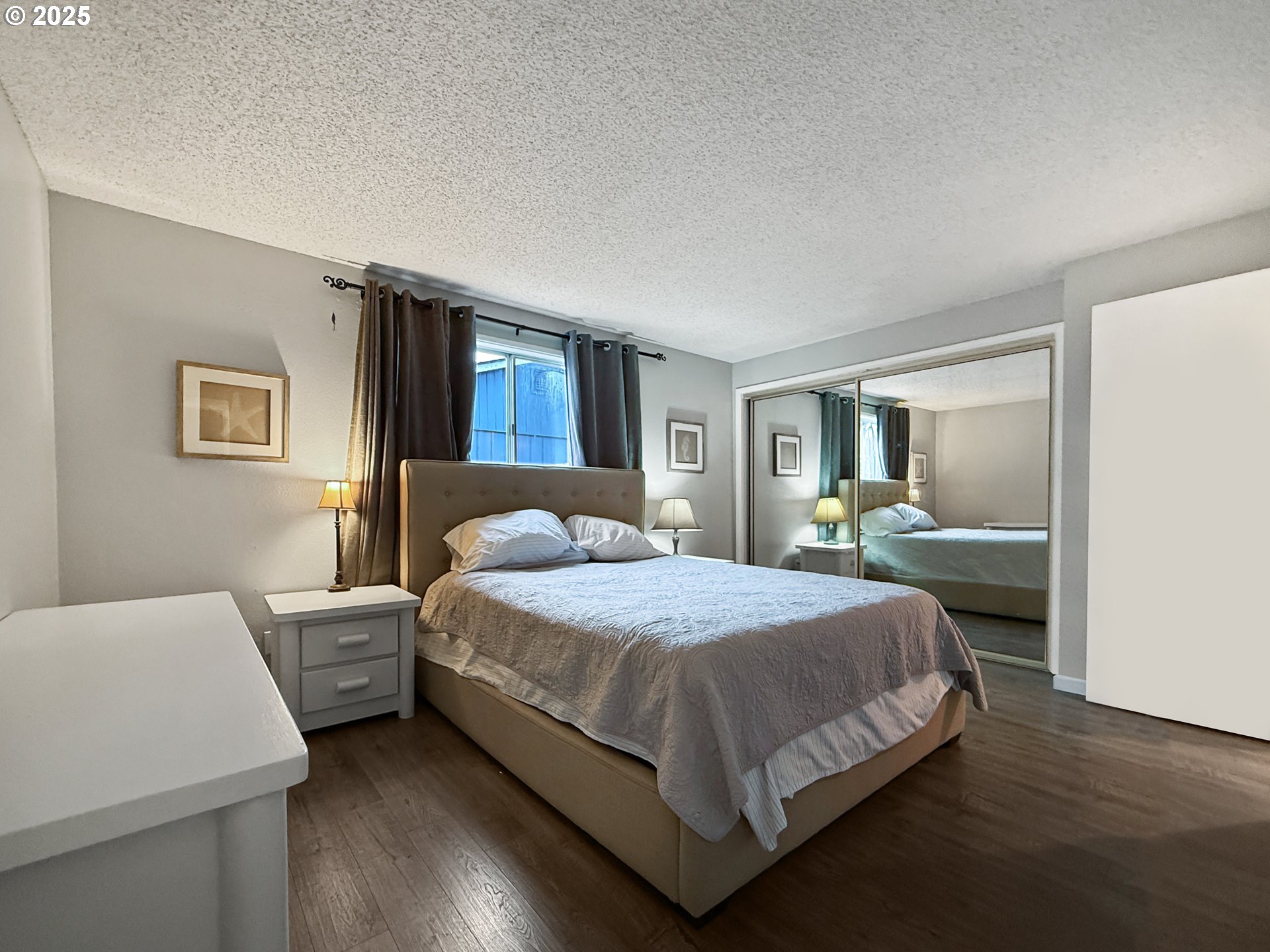 1330 Crissey Circle Brookings, OR 97415 - Photo 23 of 42 a bedroom with a bed table and window