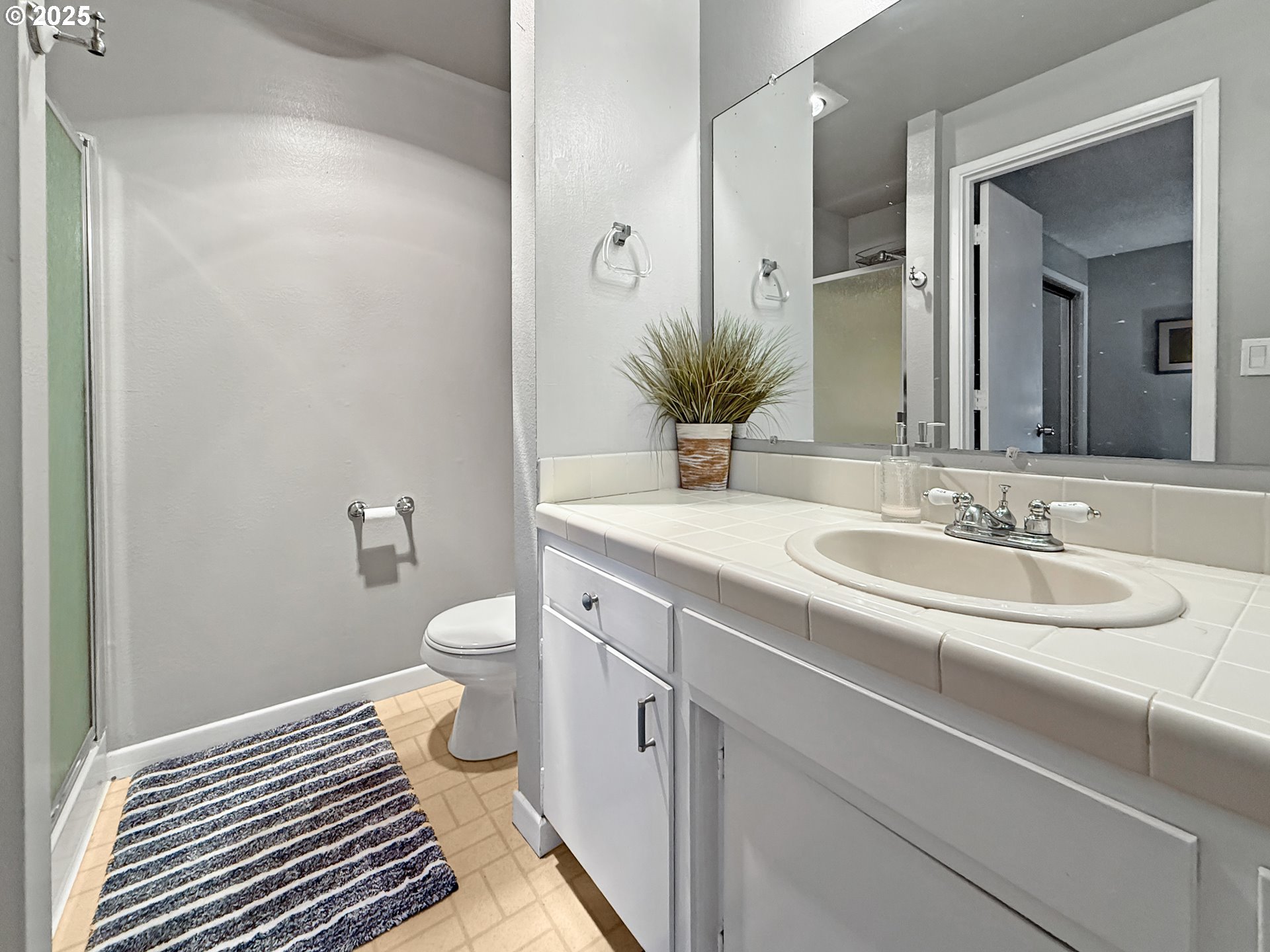 1330 Crissey Circle Brookings, OR 97415 - Photo 26 of 42 a bathroom with a granite countertop toilet sink and mirror