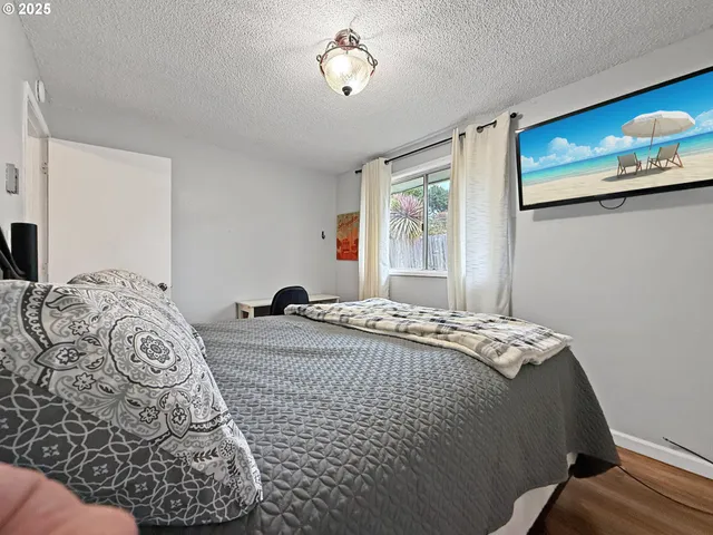 a bedroom with a bed and a table