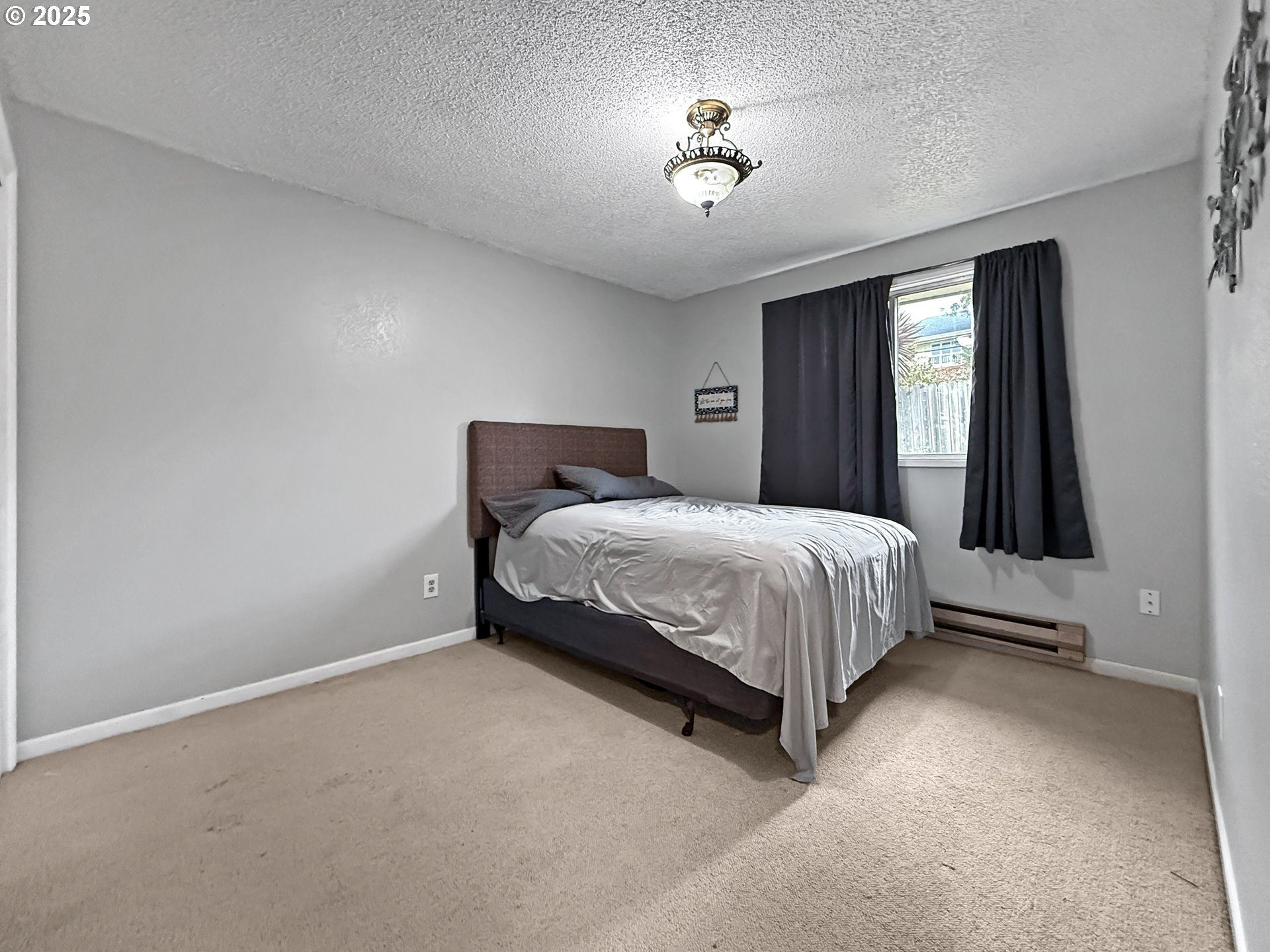 1330 Crissey Circle Brookings, OR 97415 - Photo 32 of 42 a bedroom with a bed and a table