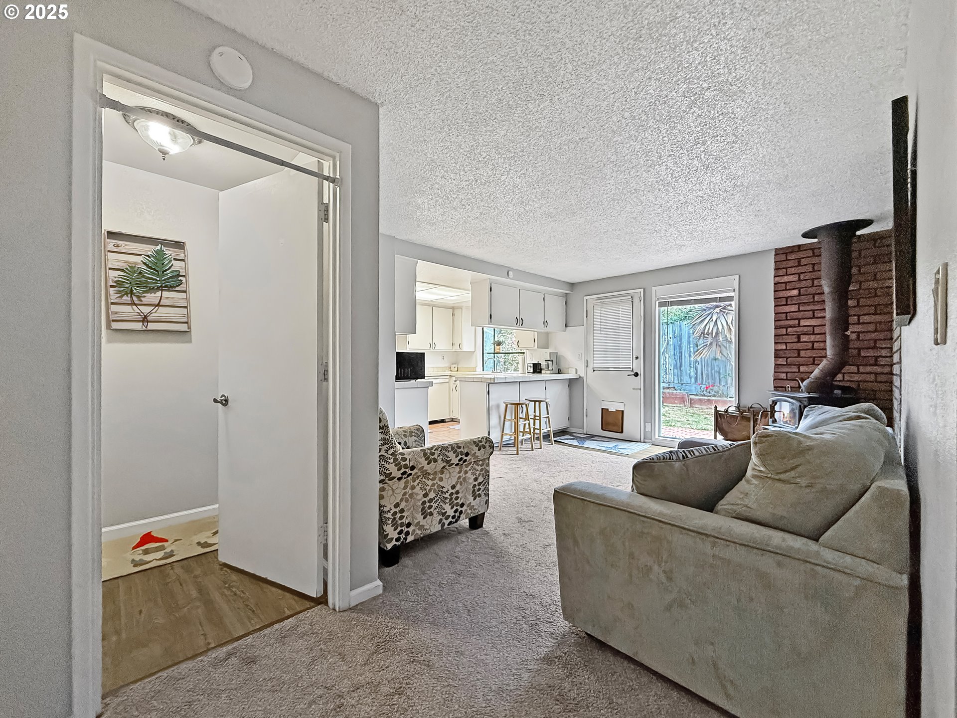 1330 Crissey Circle Brookings, OR 97415 - Photo 35 of 42 a living room with furniture and a large window