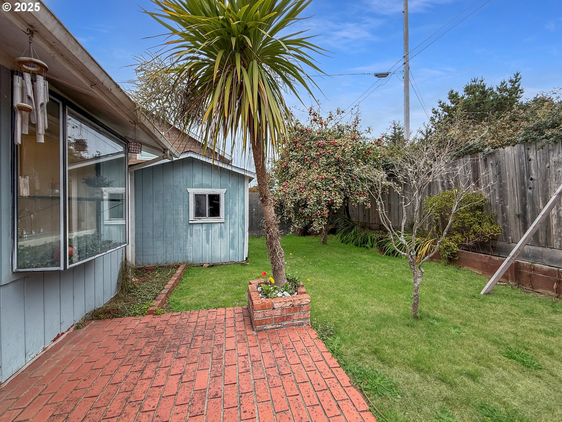 1330 Crissey Circle Brookings, OR 97415 - Photo 36 of 42 a house with a garden and trees