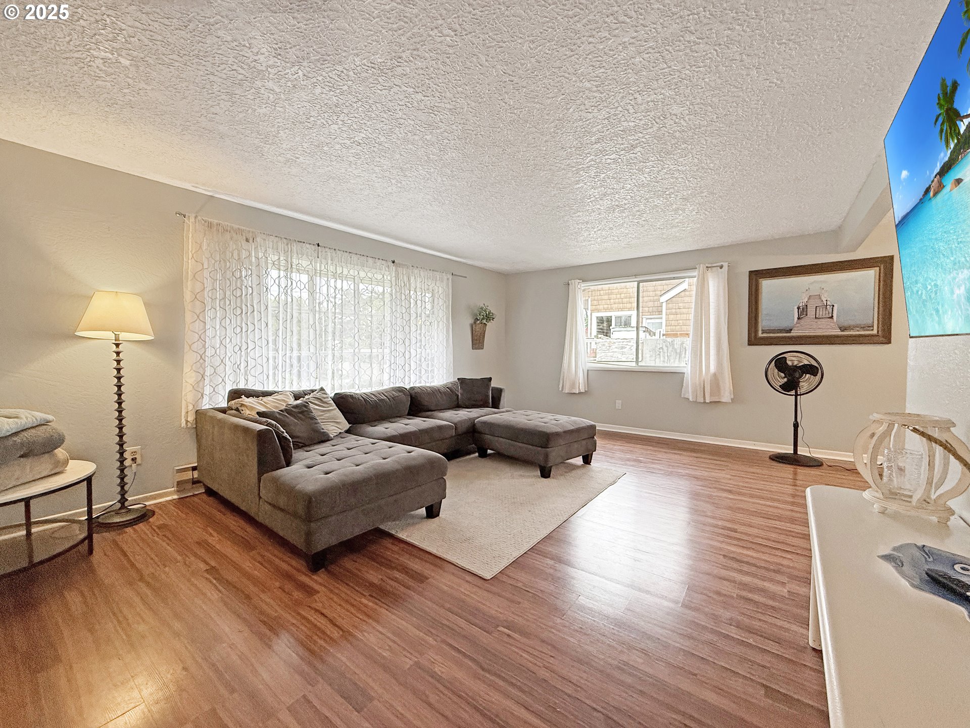 1330 Crissey Circle Brookings, OR 97415 - Photo 5 of 42 a living room with furniture and a wooden floor