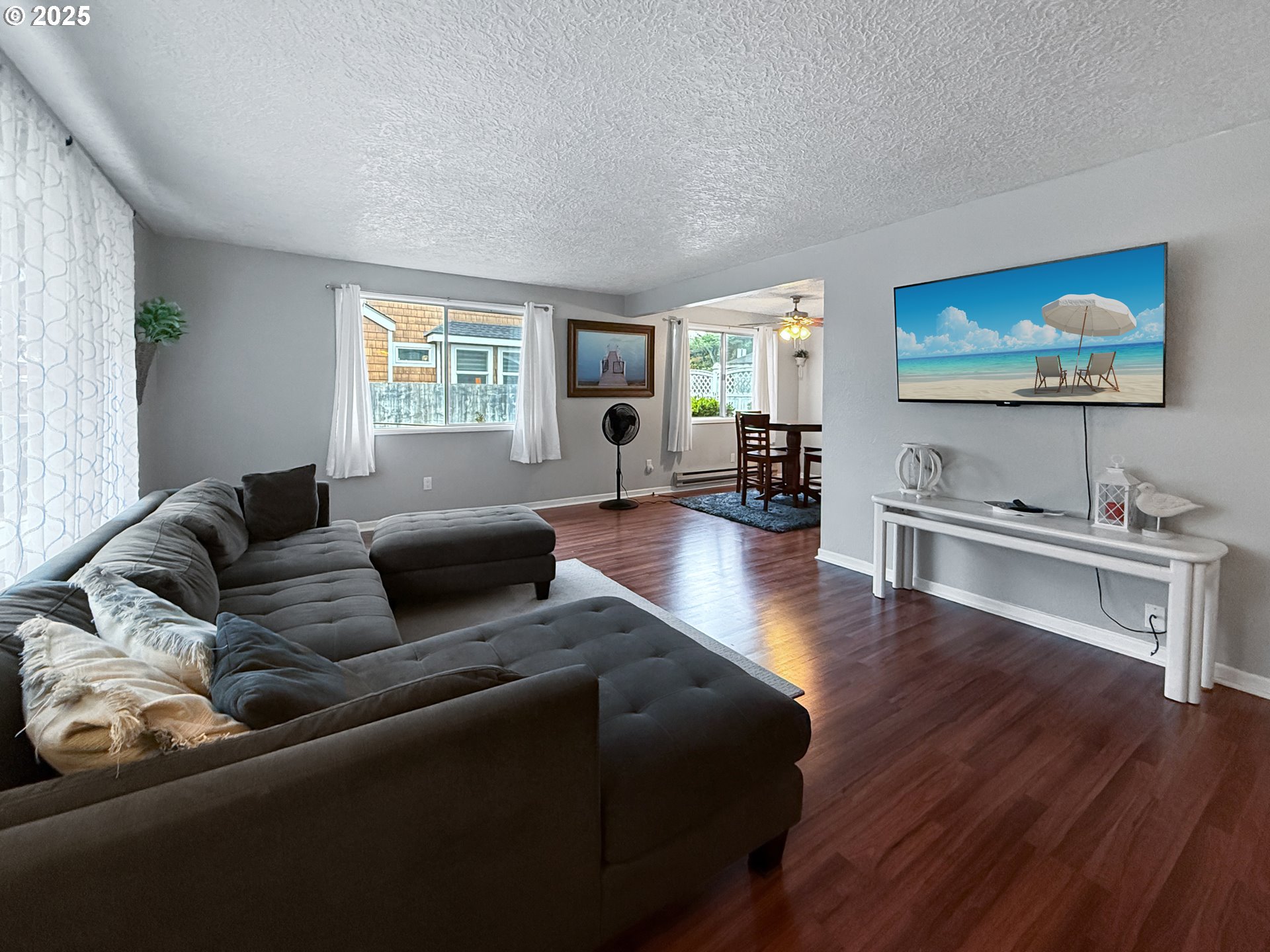 1330 Crissey Circle Brookings, OR 97415 - Photo 6 of 42 a living room with furniture and a flat screen tv
