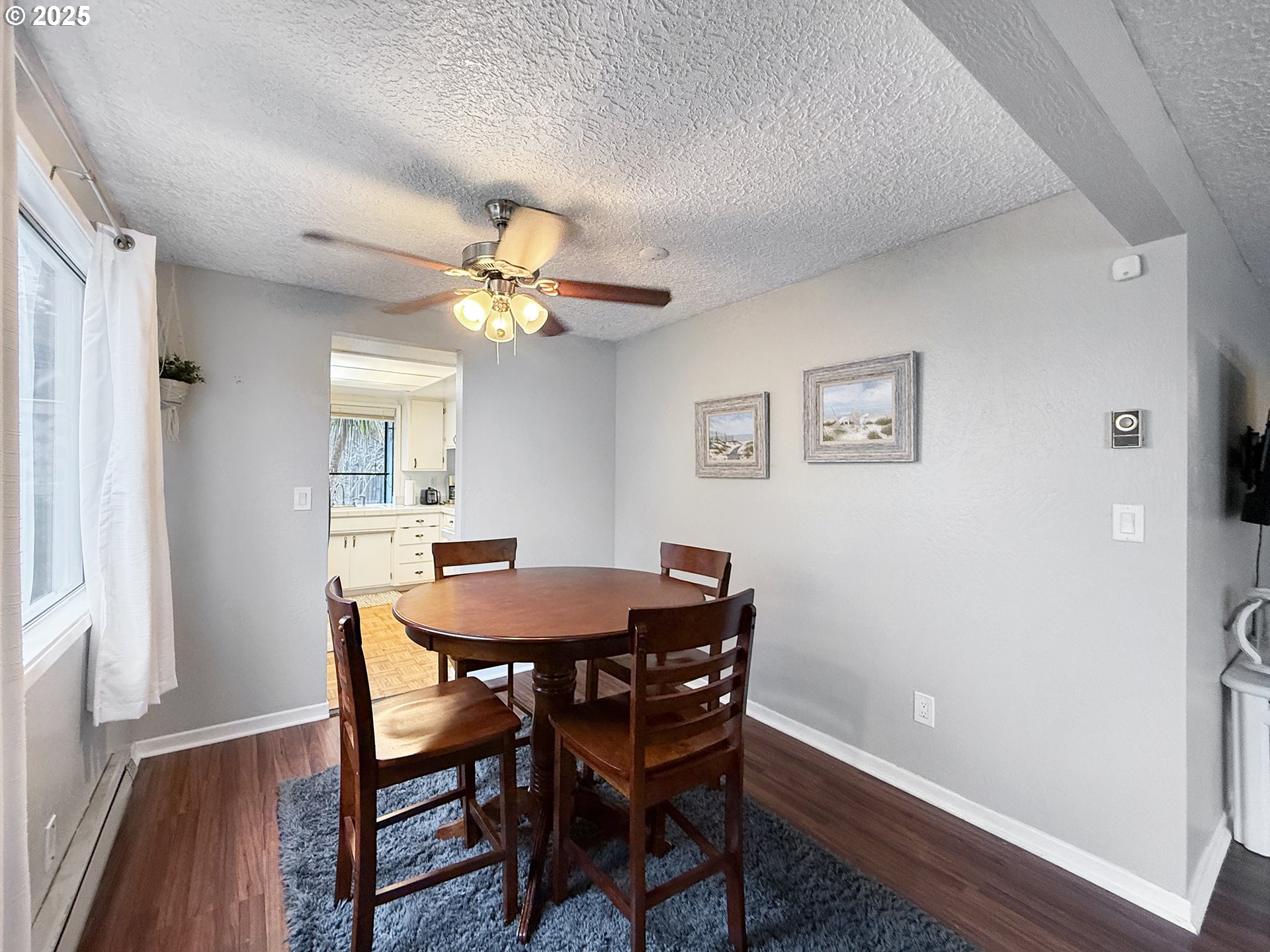 1330 Crissey Circle Brookings, OR 97415 - Photo 7 of 42 a view of a dining room with furniture and wooden floor