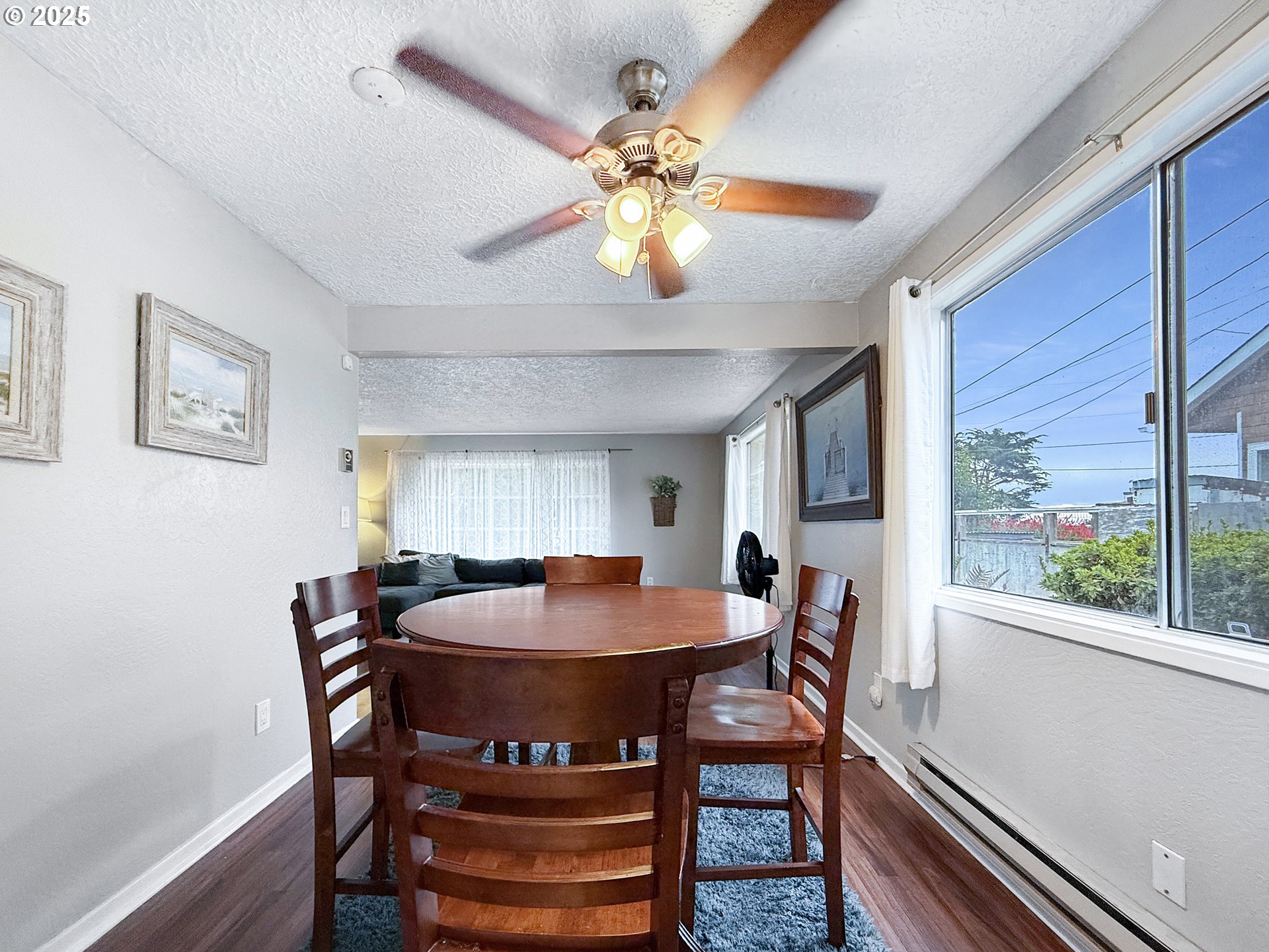 1330 Crissey Circle Brookings, OR 97415 - Photo 9 of 42 a view of a dining room with furniture window and wooden floor