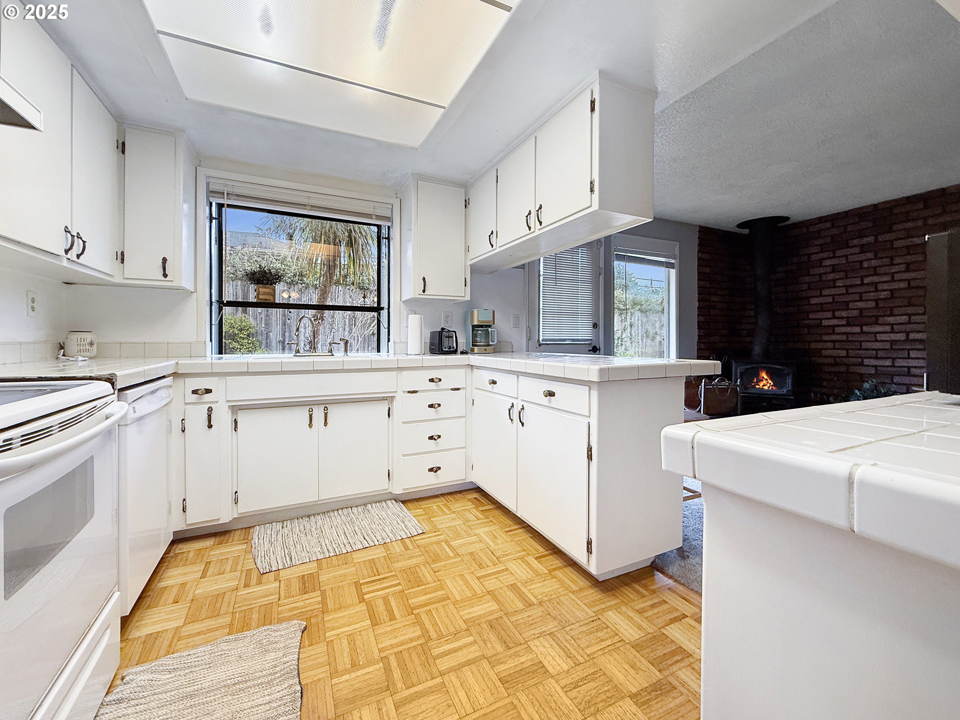 1330 Crissey Circle Brookings, OR 97415 - Photo 10 of 42 a kitchen with granite countertop a sink a stove a microwave and cabinets