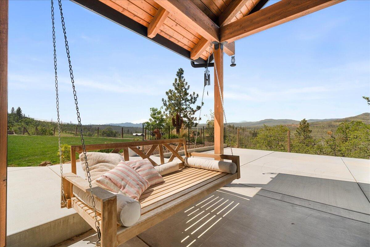 2220 Butte Falls Highway Eagle Point, OR 97524 - Photo 49 of 69 a view of a patio with a table chairs and a table