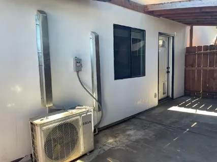a view of storage and utility room with a washer dryer