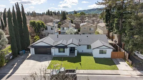 an aerial view of a house with a garden