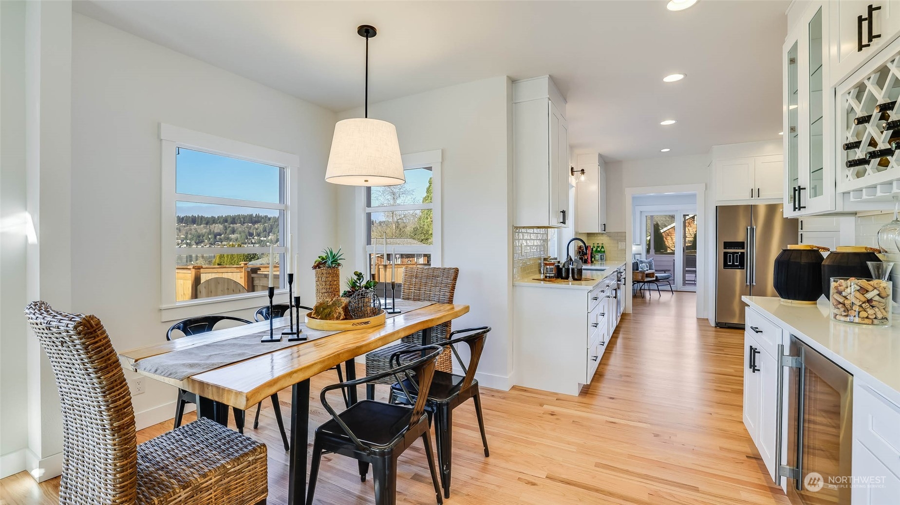1018 North 34th Street Renton, WA 98056 - Photo 11 of 40 a view of a dining room with furniture window and wooden floor