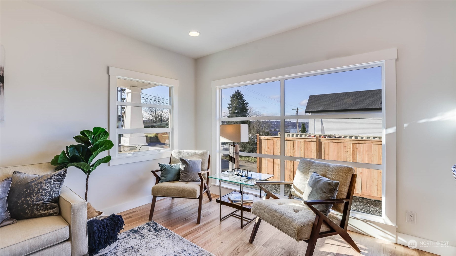 1018 North 34th Street Renton, WA 98056 - Photo 12 of 40 a living room with furniture and a flat screen tv