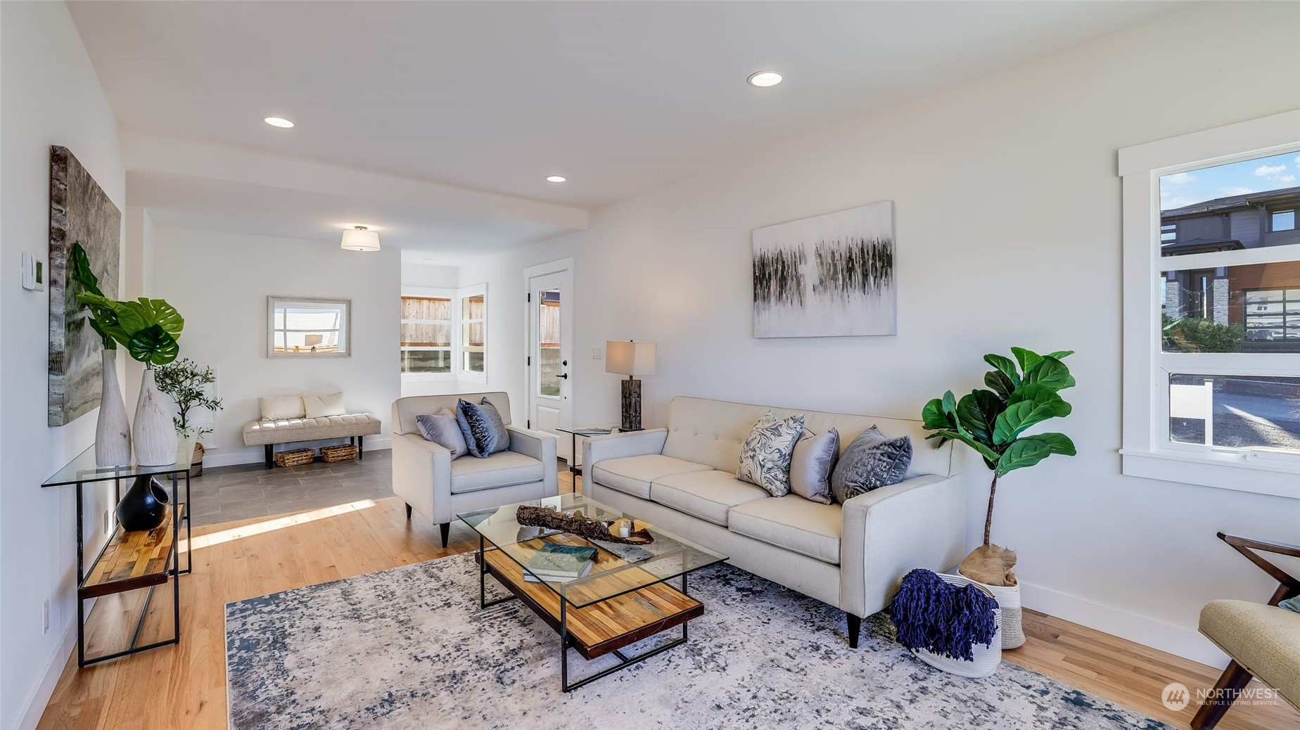 1018 North 34th Street Renton, WA 98056 - Photo 13 of 40 a living room with furniture potted plant and a window