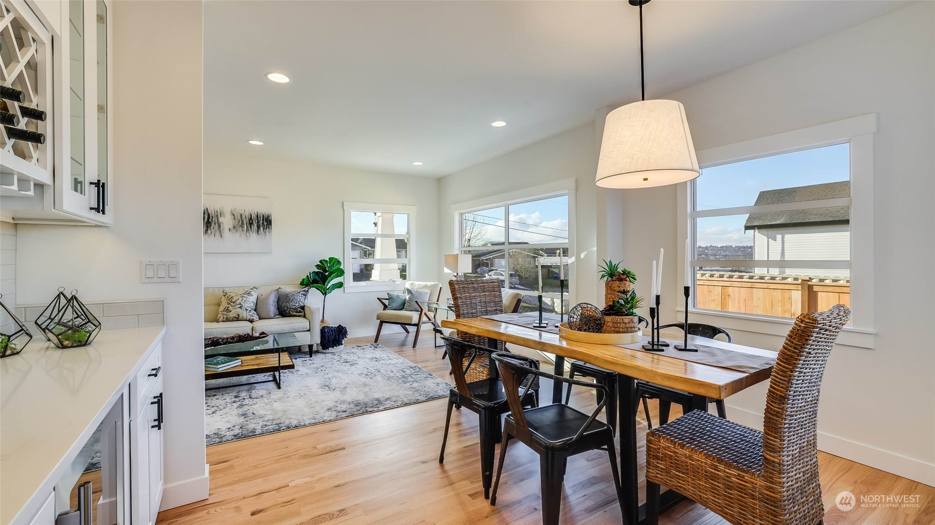 1018 North 34th Street Renton, WA 98056 - Photo 16 of 40 a view of a dining room with furniture and wooden floor