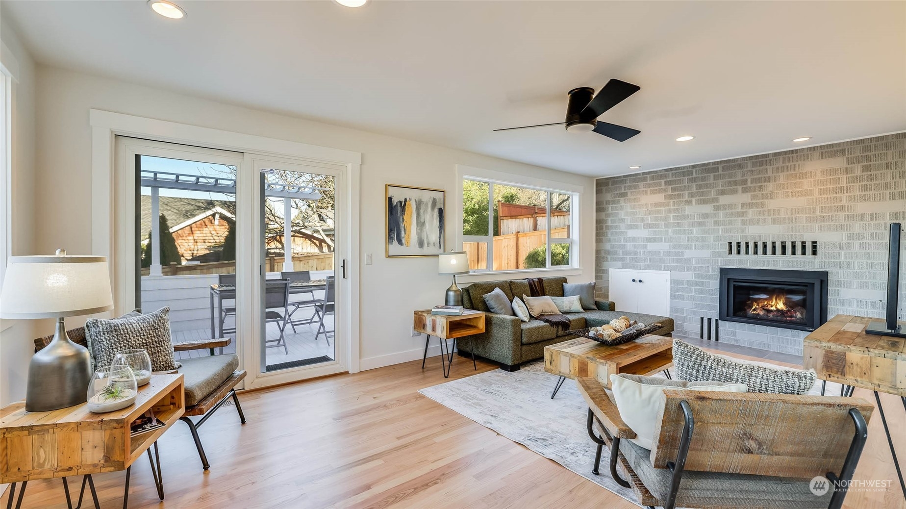 1018 North 34th Street Renton, WA 98056 - Photo 21 of 40 a living room with furniture and a fireplace