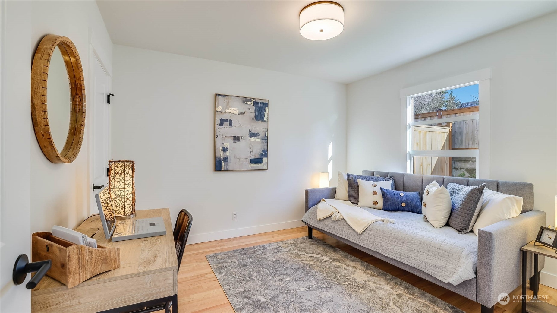 1018 North 34th Street Renton, WA 98056 - Photo 26 of 40 a living room with furniture and a mirror