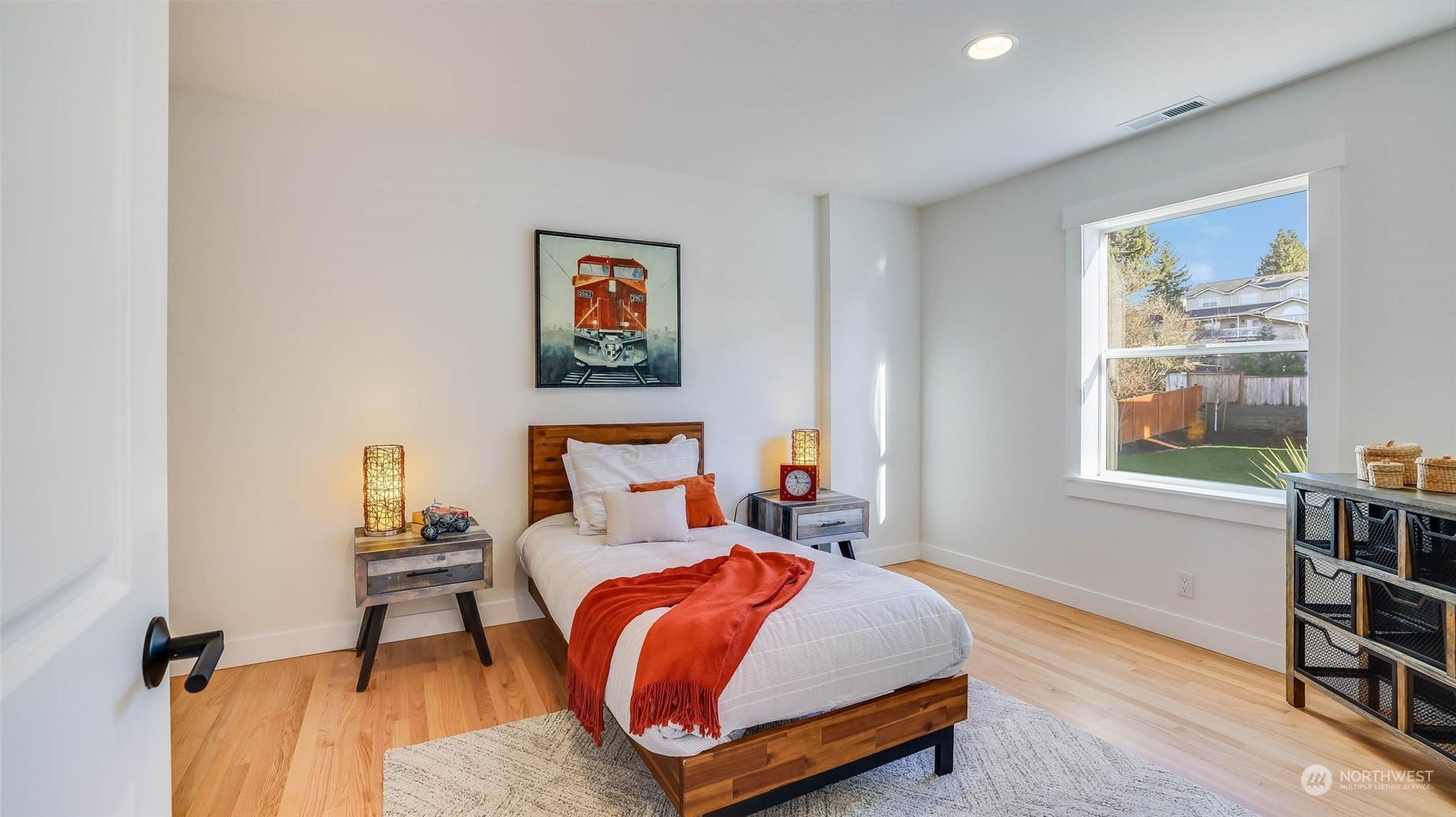 1018 North 34th Street Renton, WA 98056 - Photo 29 of 40 a bed room with a bed and a chair