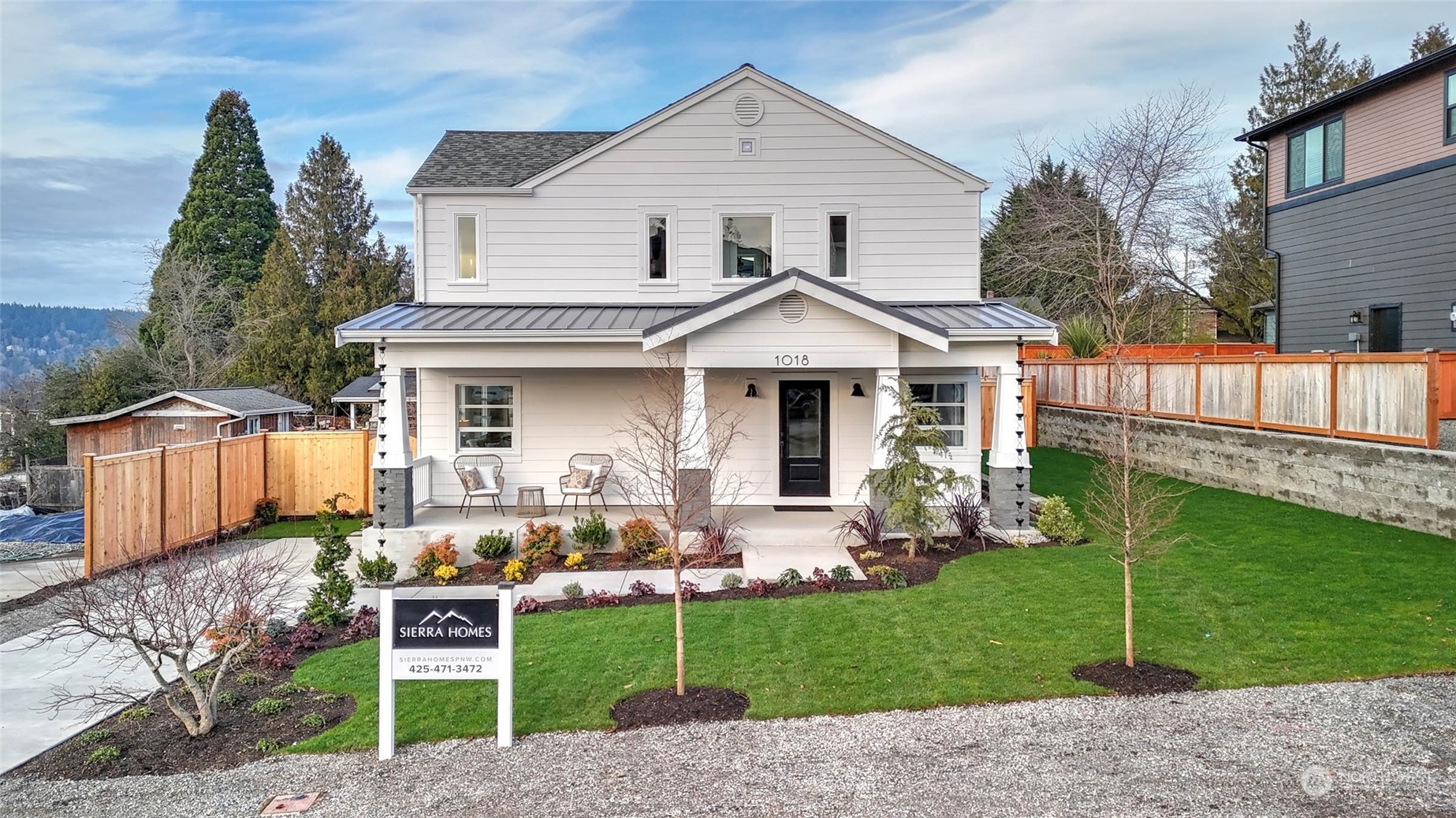 1018 North 34th Street Renton, WA 98056 - Photo 3 of 40 a front view of a house with garden
