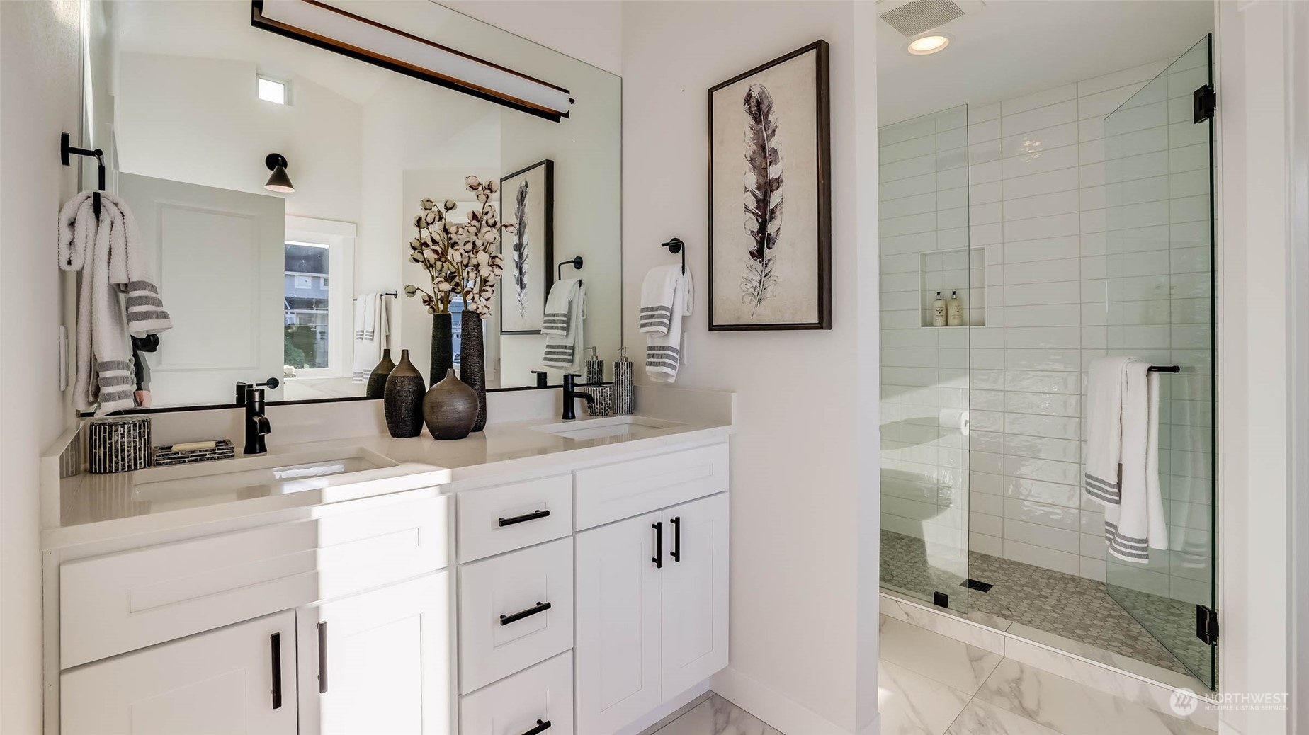 1018 North 34th Street Renton, WA 98056 - Photo 34 of 40 a bathroom with a shower sink and mirror