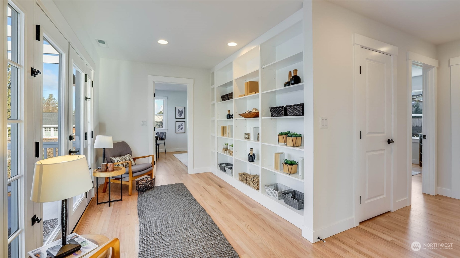 1018 North 34th Street Renton, WA 98056 - Photo 36 of 40 a living room with furniture and wooden floor